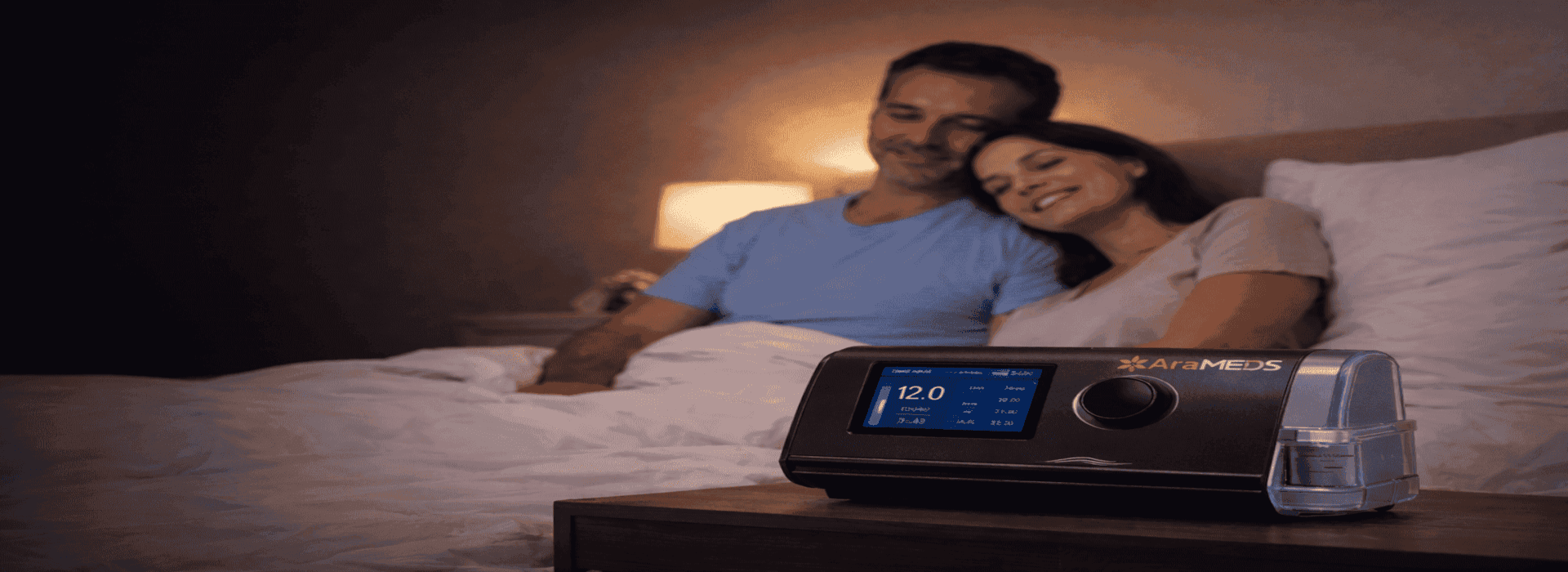 AraMEDS advanced sleep therapy CPAP device beside couple sleeping peacefully
